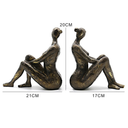 Escultura decorativa abstrata para estantes e mesas, com design moderno e acabamento bronze sofisticado.