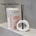 difusor aromático circular branco com varetas, design moderno para decoração e aromaterapia