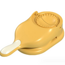 Máquina de fazer pastel amarela com alça ergonômica, ideal para cozinhar rápido e com praticidade.