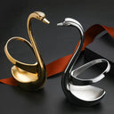 Suporte cisne dourado e prata com talheres em inox para sobremesa