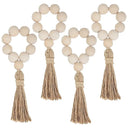 Porta-guardanapo artesanal com contas de madeira natural e tassel de juta – estilo boho e rústico para mesa posta elegante.