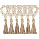 Porta-guardanapo artesanal com contas de madeira natural e tassel de juta – estilo boho e rústico para mesa posta elegante.