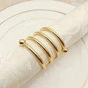 Porta-guardanapos metálicos vazados com acabamento eletroplated em Espiral Dourado para decoração de mesa posta