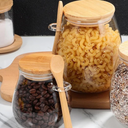 Kit com 2 potes de vidro oval com tampa de bambu e colher — beleza, frescor e funcionalidade para sua cozinha.