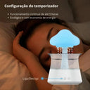 Umidificador Cloud Rain RGB com base branca liberando efeito chuva para reservatório transparente