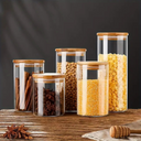 Kit com 5 potes de vidro com tampa de bambu de 650ml a 1750ml — sofisticação funcional para organizar sua cozinha.