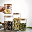 Kit com 5 potes de vidro com tampa de bambu de 650ml a 1750ml — sofisticação funcional para organizar sua cozinha.
