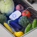 Purificador ultrassônico portátil para limpeza profunda de frutas e vegetais.