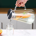  Jarra de vidro transparente resistente ao calor com tampa e filtro em inox, alça ergonômica, ideal para água aromatizada com limão e gelo