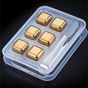 Kit com cubos dourados reutilizáveis para whisky. Aço inox, pinça de servir e estojo. Sofisticação ao servir sem diluir.