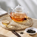 Chaleira de vidro com infusor 800ml sobre chama de fogão com chá borbulhando - Casa Splêndida