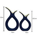 Dupla de vasos decorativos em cerâmica com design curvo e acabamento fosco em várias cores