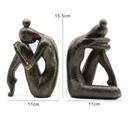 Escultura decorativa abstrata para estantes e mesas, com design moderno e acabamento bronze sofisticado.