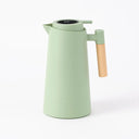 Garrafa térmica verde claro com design minimalista e medidas destacadas – Casa Splendida