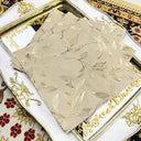 Guardanapos de papel bege com estampa dourada floral em suporte metálico dourado – Casa Splendida