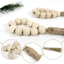 Porta-guardanapo artesanal com contas de madeira natural e tassel de juta – estilo boho e rústico para mesa posta elegante.

