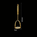 Amassador de batatas dourado em aço inox Casa Splendida, utensílio de cozinha para purês lisos e cremosos.